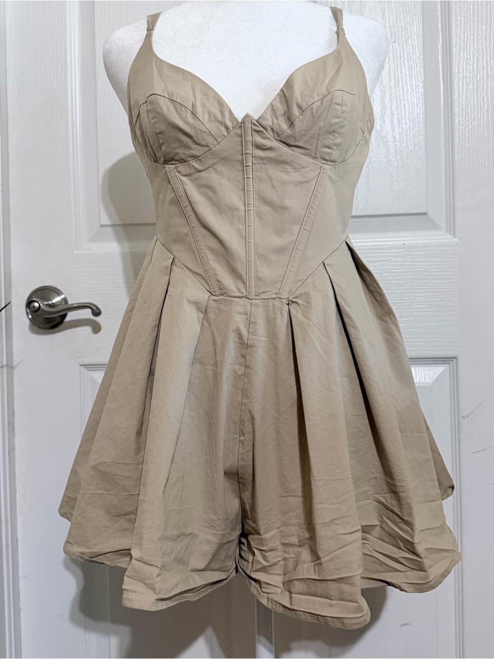 Princess Polly tan Malcom playsuit in a US 10
Corset romper